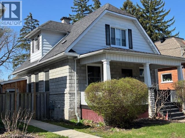 Traditional residence featuring a covered front porch with columnar supports - 838 Moore Street, Cambridge, ON - Outdoor With Deck Patio Veranda