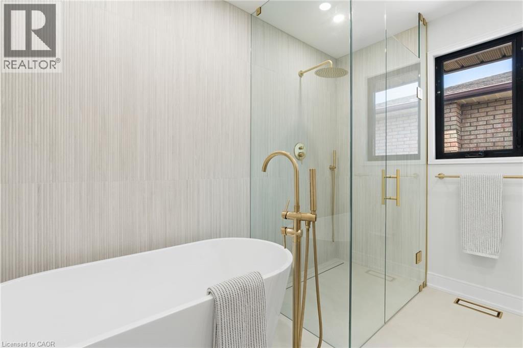 Full bath featuring a soaking tub, a shower stall, and recessed lighting - 17 Clearview Drive, Hamilton, ON - Indoor Photo Showing Bathroom