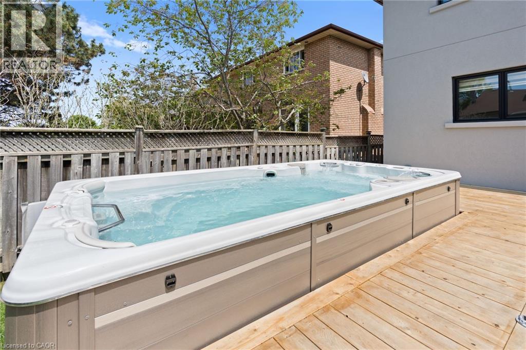 Wooden terrace with a hot tub - 17 Clearview Drive, Hamilton, ON - Outdoor With Exterior