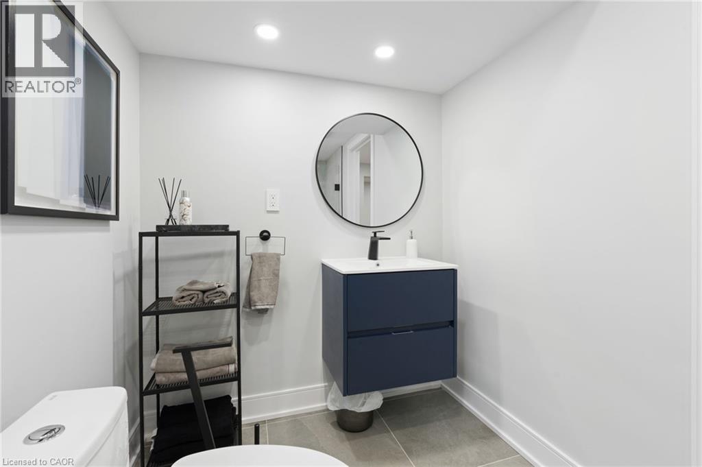 Bathroom featuring vanity, light tile patterned flooring, and recessed lighting - 17 Clearview Drive, Hamilton, ON - Indoor Photo Showing Bathroom