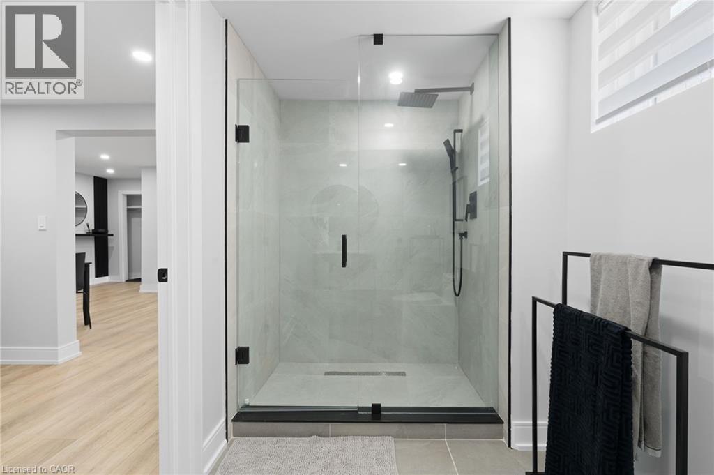 Bathroom with a stall shower, recessed lighting, and light tile patterned floors - 17 Clearview Drive, Hamilton, ON - Indoor Photo Showing Bathroom