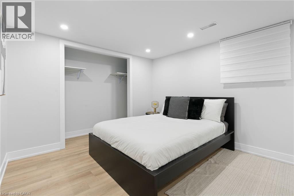 Bedroom with light wood finished floors, a closet, and recessed lighting - 17 Clearview Drive, Hamilton, ON - Indoor Photo Showing Bedroom