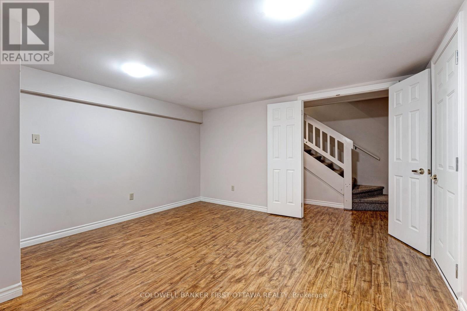 Lower level recreation room with laminate flooring - 12 Glenview Crescent, Perth, ON - Indoor Photo Showing Other Room