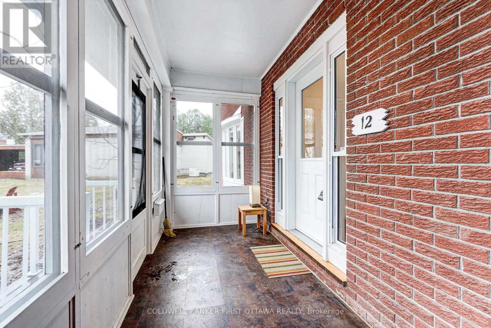 Classic enclosed porch welcomes you home - 12 Glenview Crescent, Perth, ON - Indoor Photo Showing Other Room