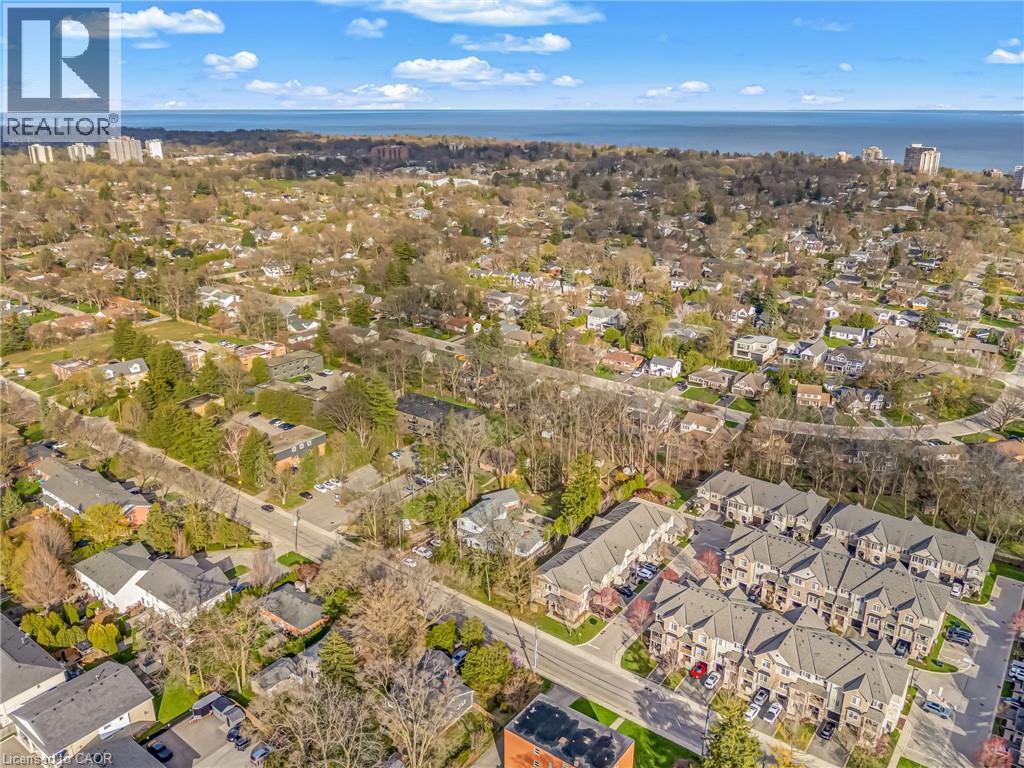 Aerial perspective showcasing a residential community with varied architectural styles and mature trees - 2123 Deyncourt Drive, Burlington, ON - Outdoor With View