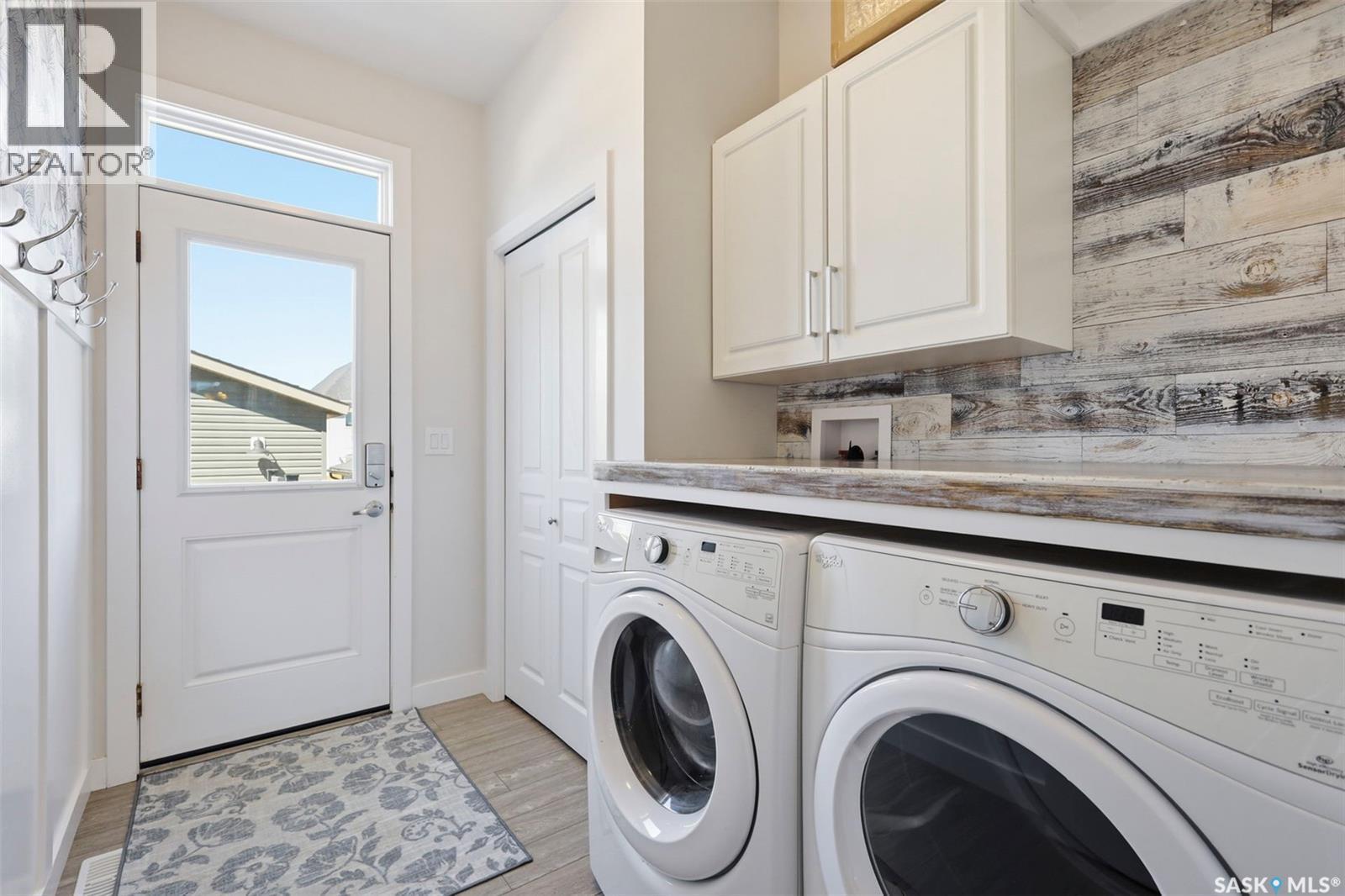 243 Newton Link, Saskatoon, SK - Indoor Photo Showing Laundry Room