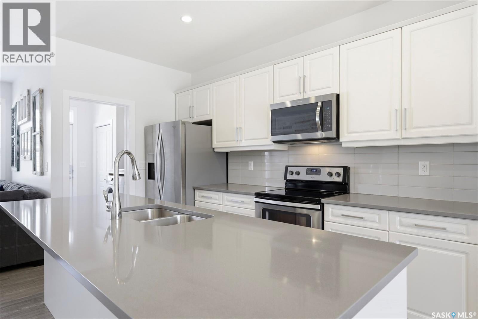 243 Newton Link, Saskatoon, SK - Indoor Photo Showing Kitchen With Stainless Steel Kitchen With Double Sink With Upgraded Kitchen