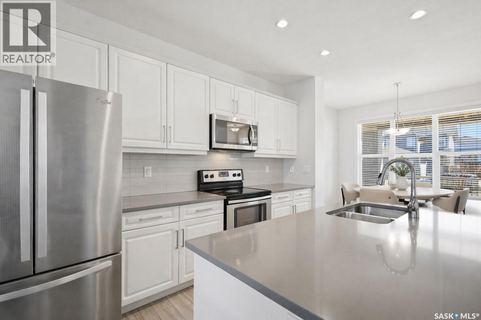 243 Newton Link, Saskatoon, SK - Indoor Photo Showing Kitchen With Stainless Steel Kitchen With Double Sink With Upgraded Kitchen