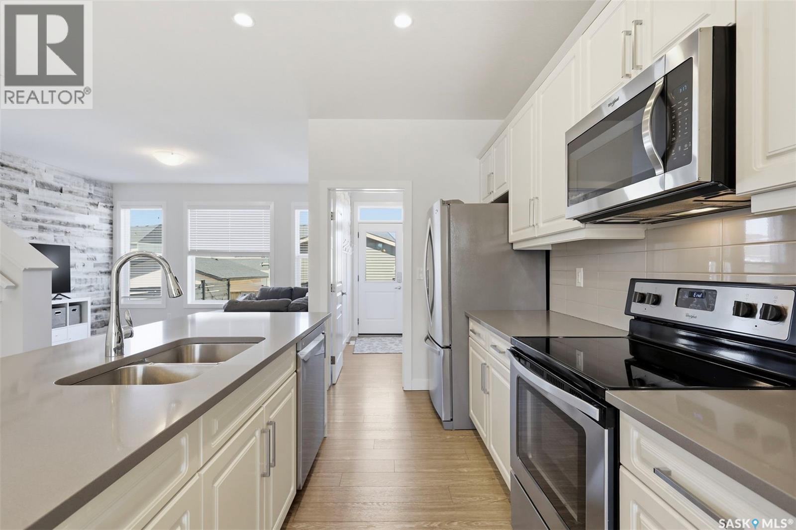 243 Newton Link, Saskatoon, SK - Indoor Photo Showing Kitchen With Stainless Steel Kitchen With Double Sink With Upgraded Kitchen