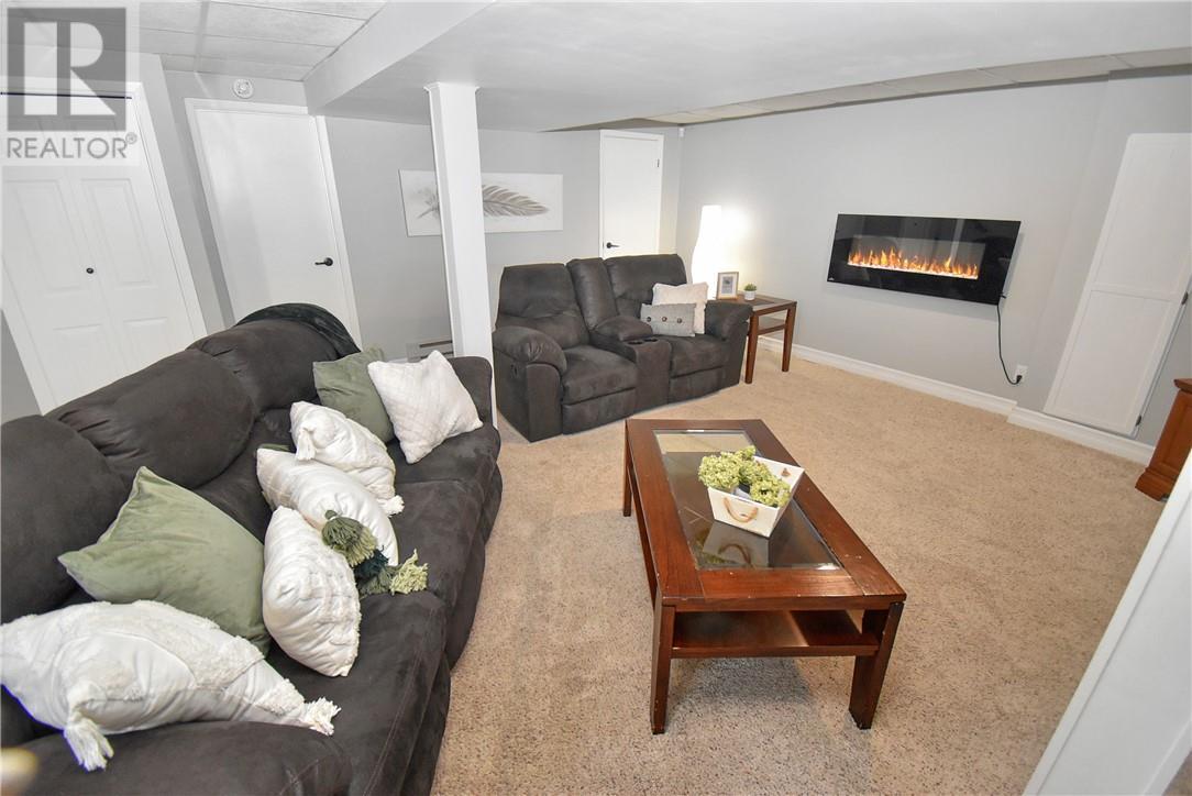 215 Orell St, Garson, ON - Indoor Photo Showing Living Room With Fireplace
