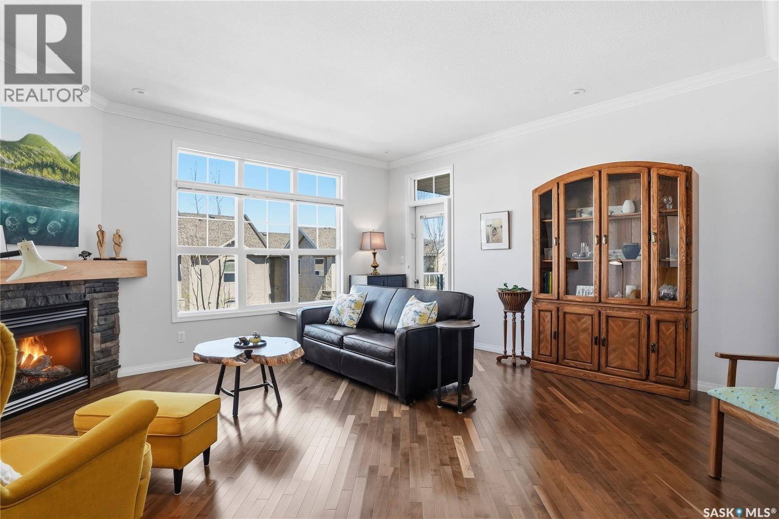 304 218 Heath Avenue, Saskatoon, SK - Indoor Photo Showing Living Room With Fireplace