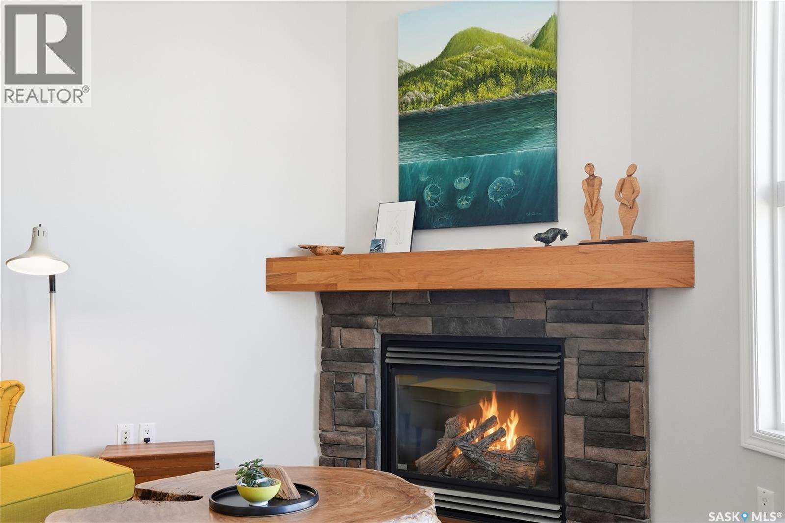 304 218 Heath Avenue, Saskatoon, SK - Indoor Photo Showing Living Room With Fireplace