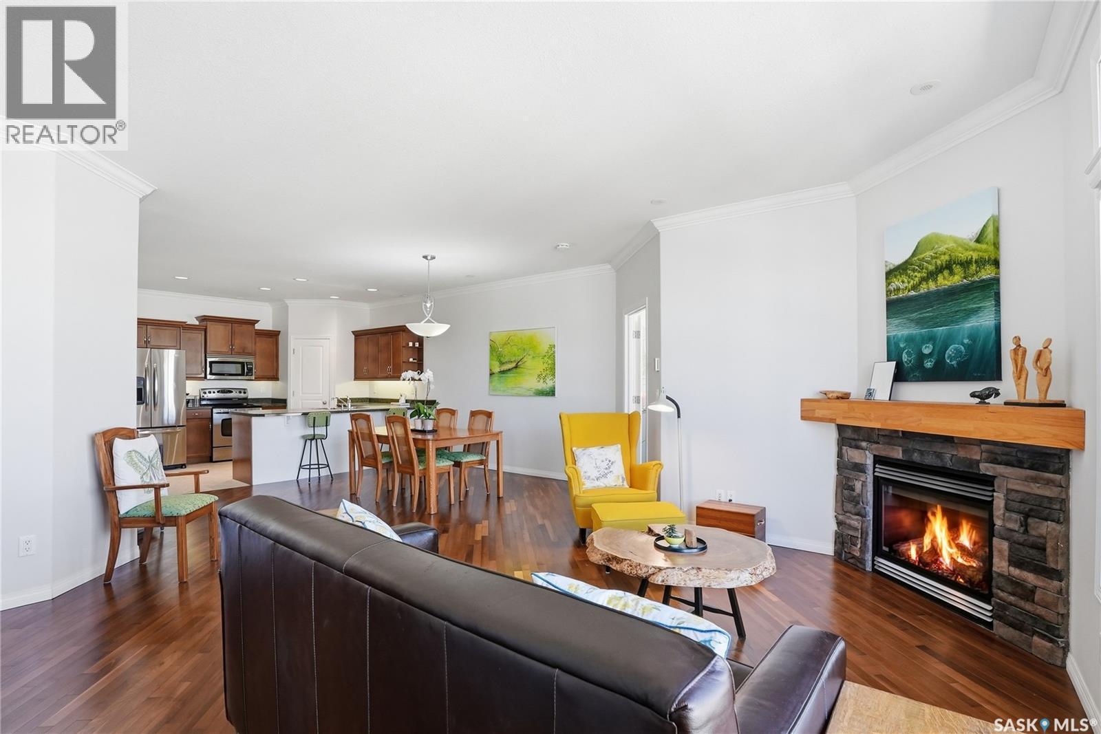 304 218 Heath Avenue, Saskatoon, SK - Indoor Photo Showing Living Room With Fireplace