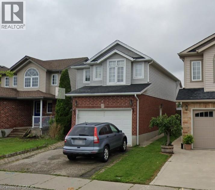 Two-story residence featuring a brick first level and light gray siding on the second level - 965 Copper Leaf Crescent, Kitchener, ON - Outdoor With Facade