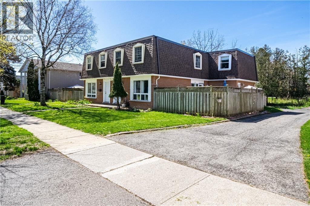 Brick facade property with a dormer roofline and multiple windows - 648 Francis Road, Burlington, ON - Outdoor