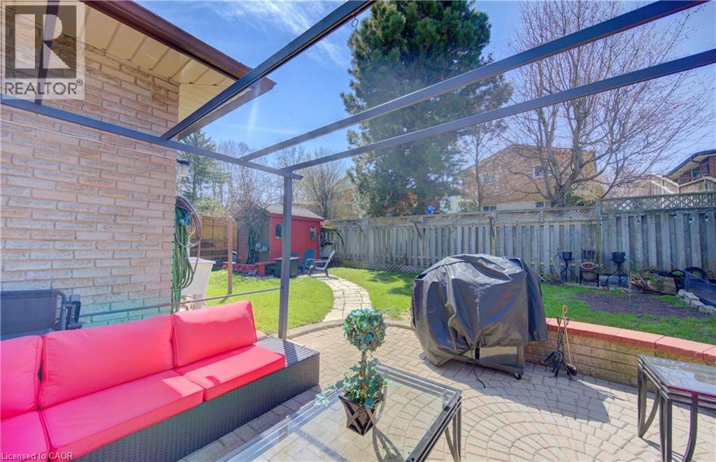 Rear patio featuring a metal pergola structure - 170 Martinglen Crescent, Kitchener, ON - Outdoor