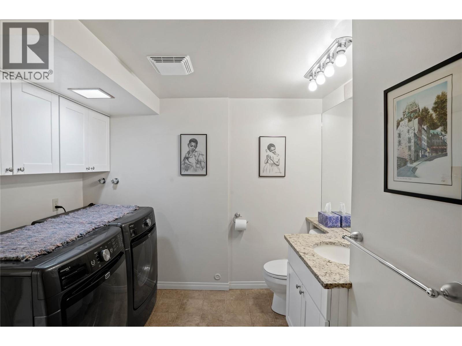 Lower level bathroom/laundry room - 1988 Dewdney Road, Kelowna, BC - Indoor Photo Showing Bathroom
