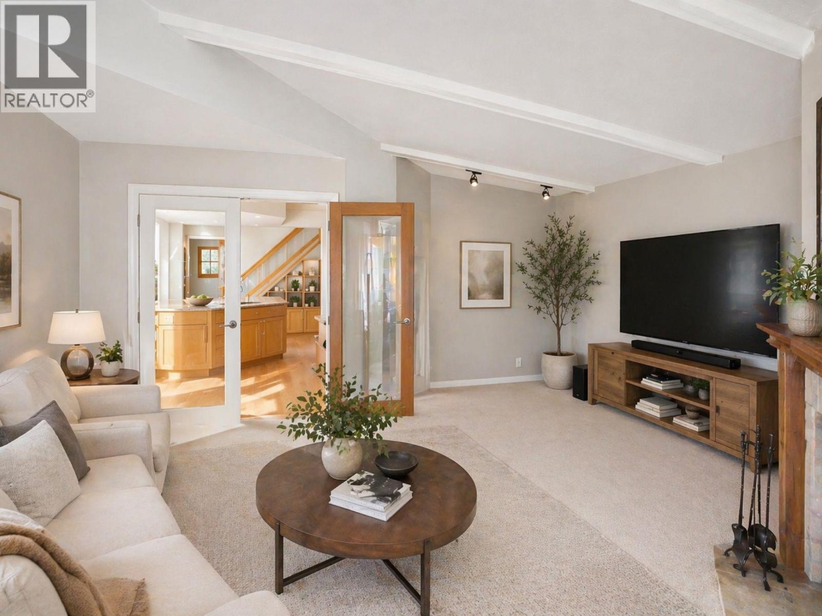Virtually staged Family room for illustrative purposes. - 1988 Dewdney Road, Kelowna, BC - Indoor Photo Showing Living Room