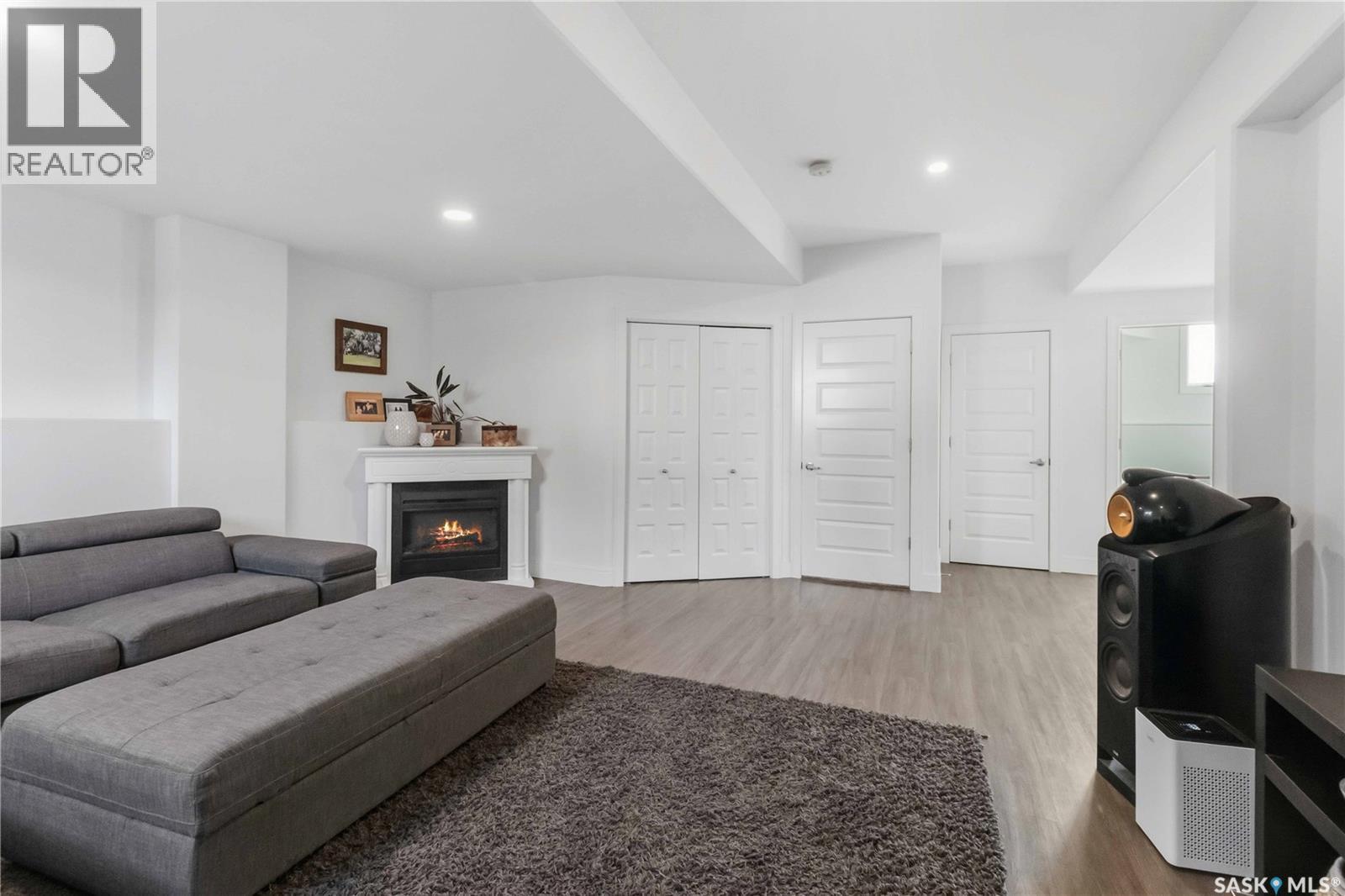 403 Delainey Road, Saskatoon, SK - Indoor Photo Showing Other Room With Fireplace