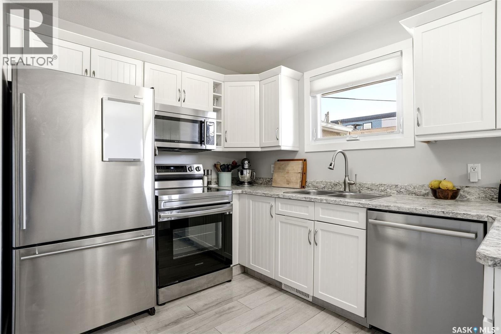 1115 12Th Avenue E, Regina, SK - Indoor Photo Showing Kitchen With Double Sink