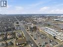 Expansive aerial perspective showcasing a major thoroughfare with commercial establishments and residential areas - 869 Barton Street E, Hamilton, ON 