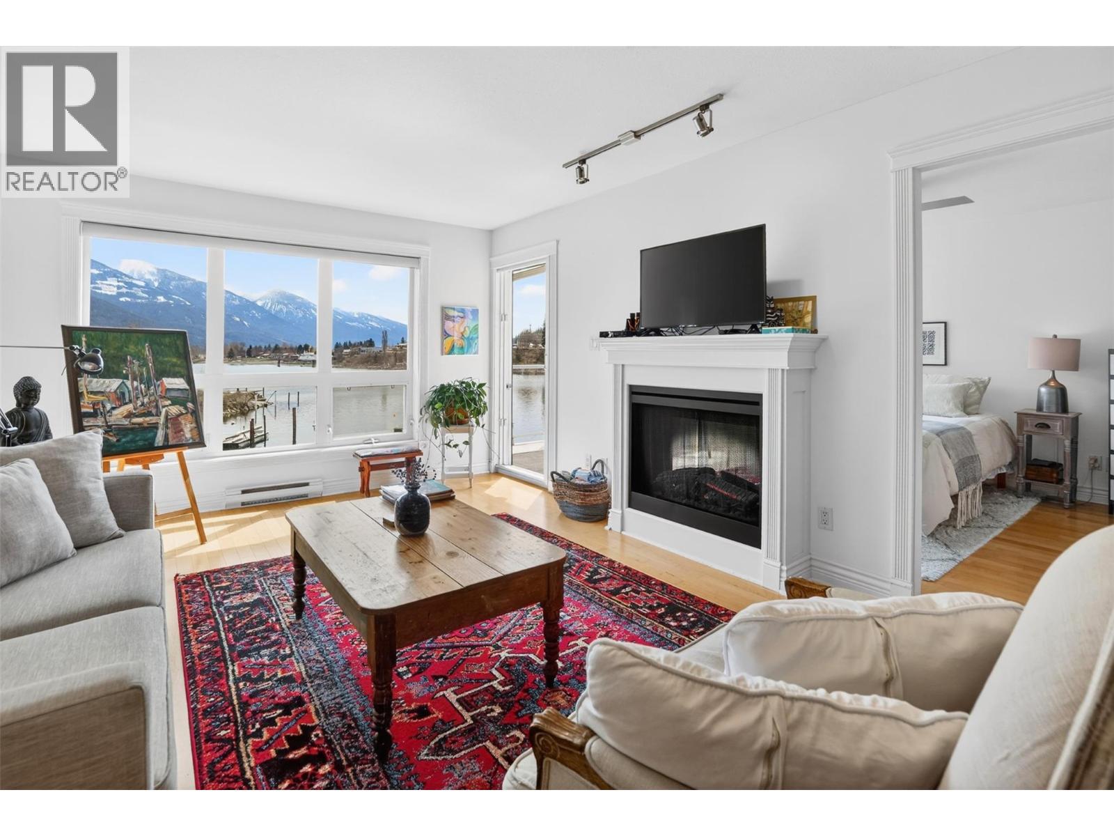 550 Rainbow Drive Unit# 302, Kaslo, BC - Indoor Photo Showing Living Room With Fireplace