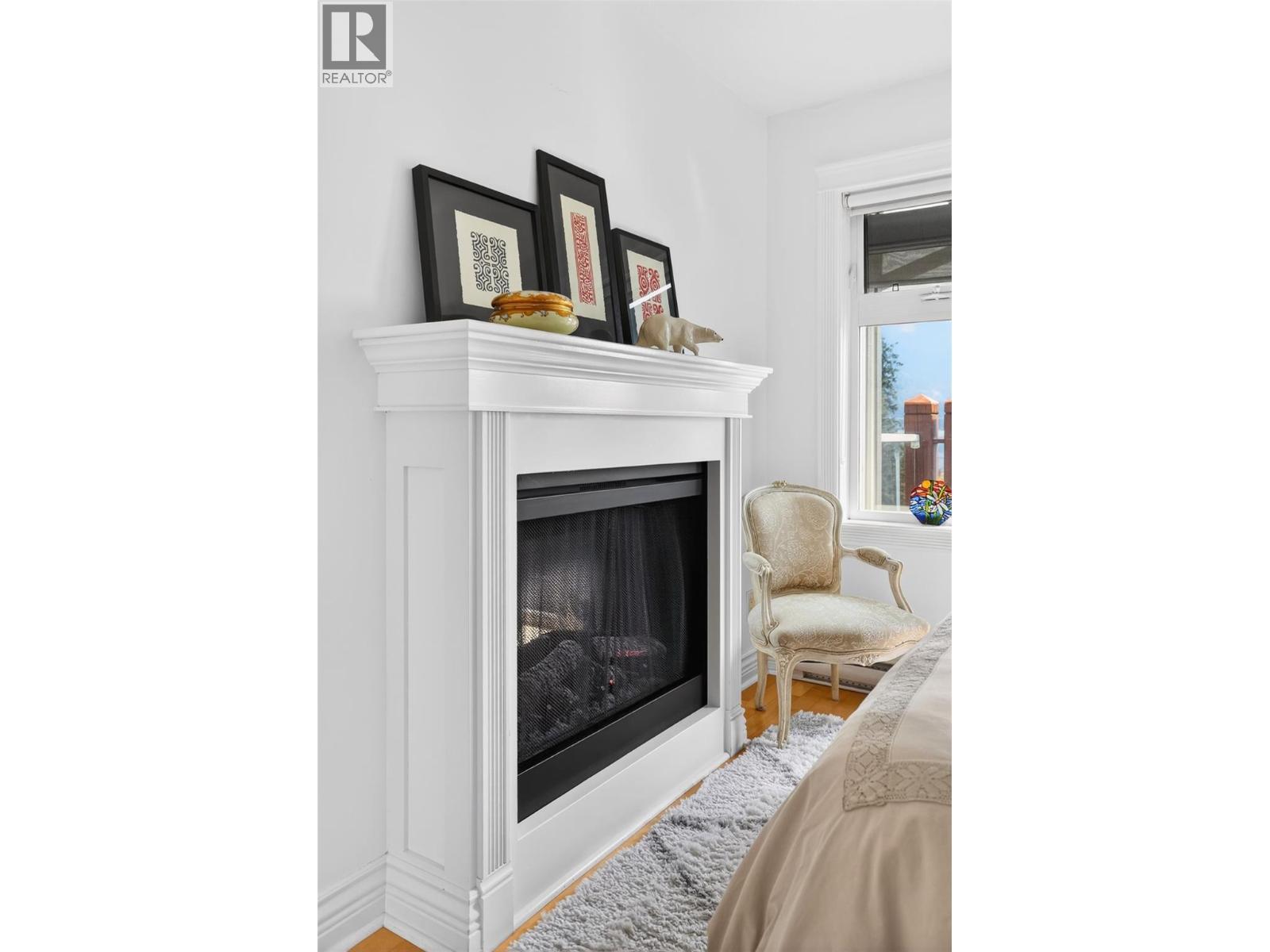 550 Rainbow Drive Unit# 302, Kaslo, BC - Indoor Photo Showing Other Room With Fireplace