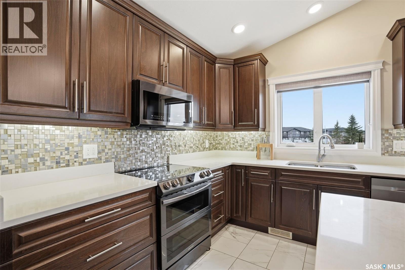 106 Johns Road, Saskatoon, SK - Indoor Photo Showing Kitchen With Double Sink