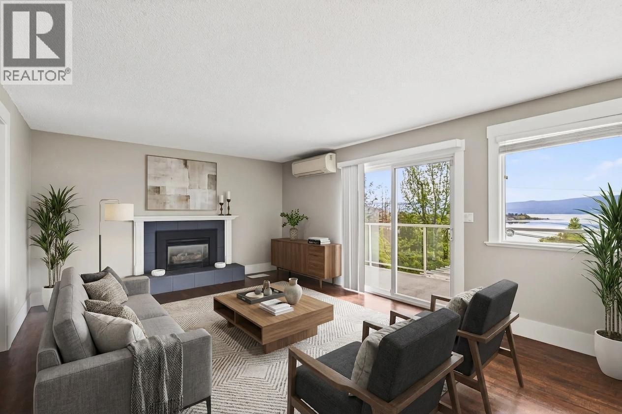 **virtually staged** - 3940 Angus Drive, West Kelowna, BC - Indoor Photo Showing Living Room With Fireplace