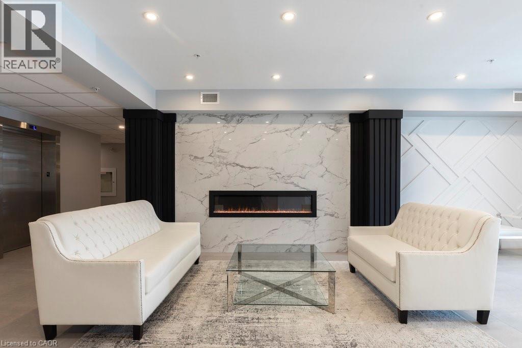 120 Springvalley Crescent Unit# 208, Hamilton, ON - Indoor With Fireplace