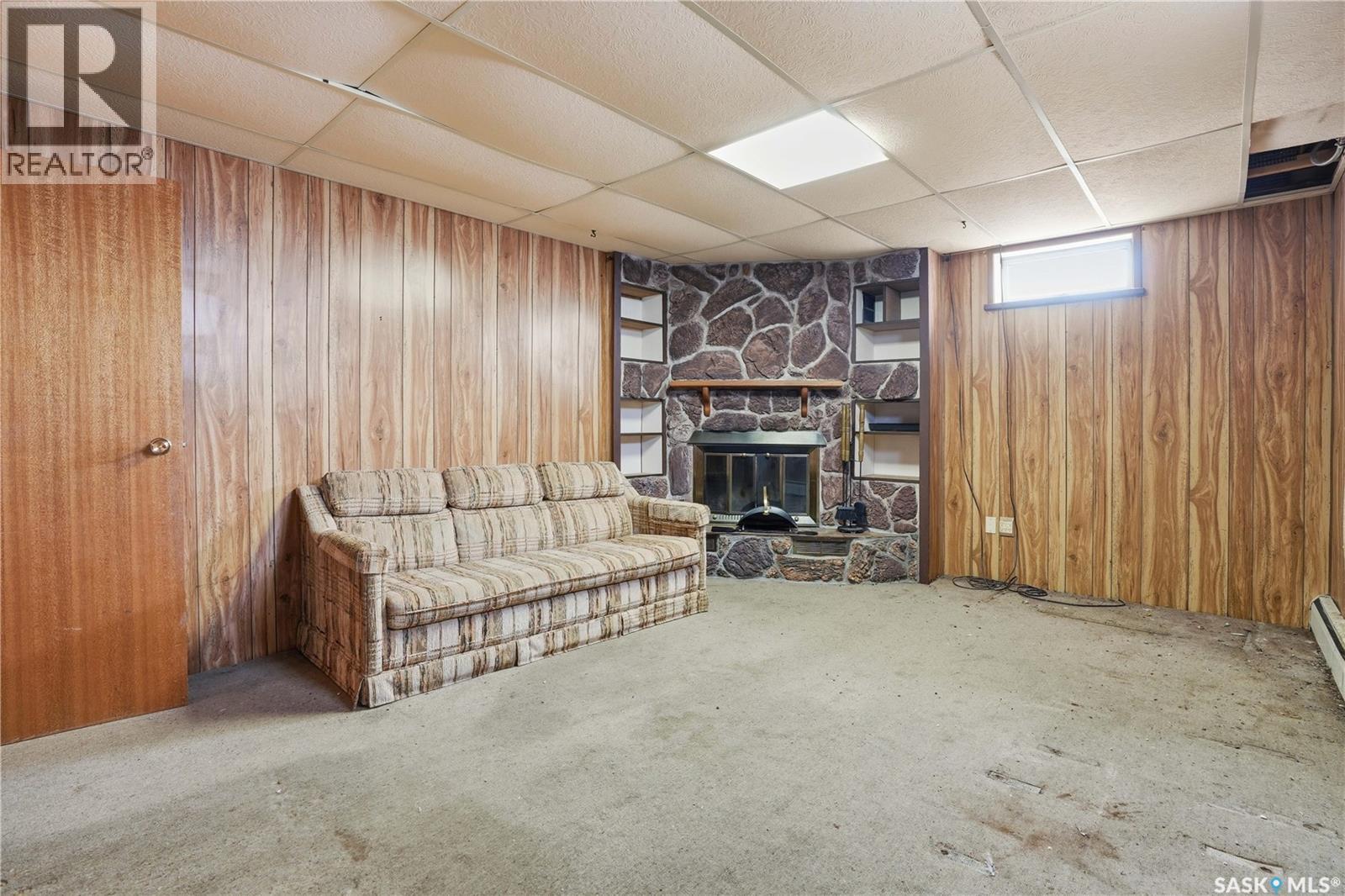 98 Main Street, Lang, SK - Indoor Photo Showing Basement With Fireplace