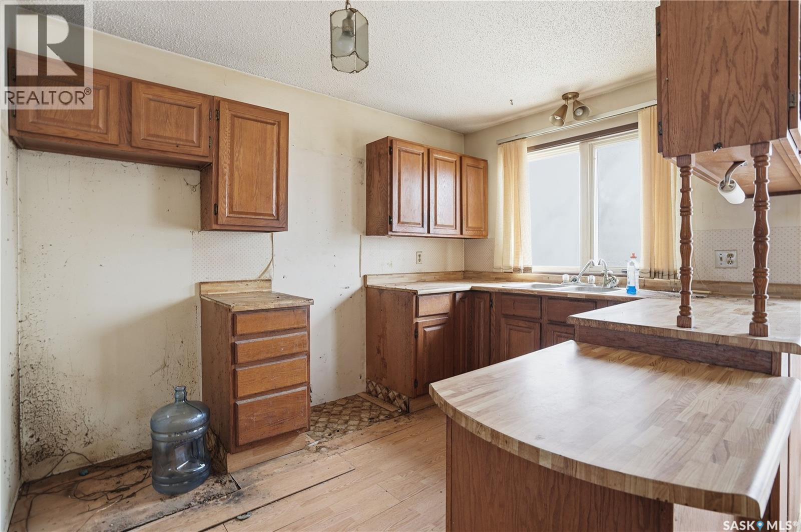 98 Main Street, Lang, SK - Indoor Photo Showing Kitchen With Double Sink