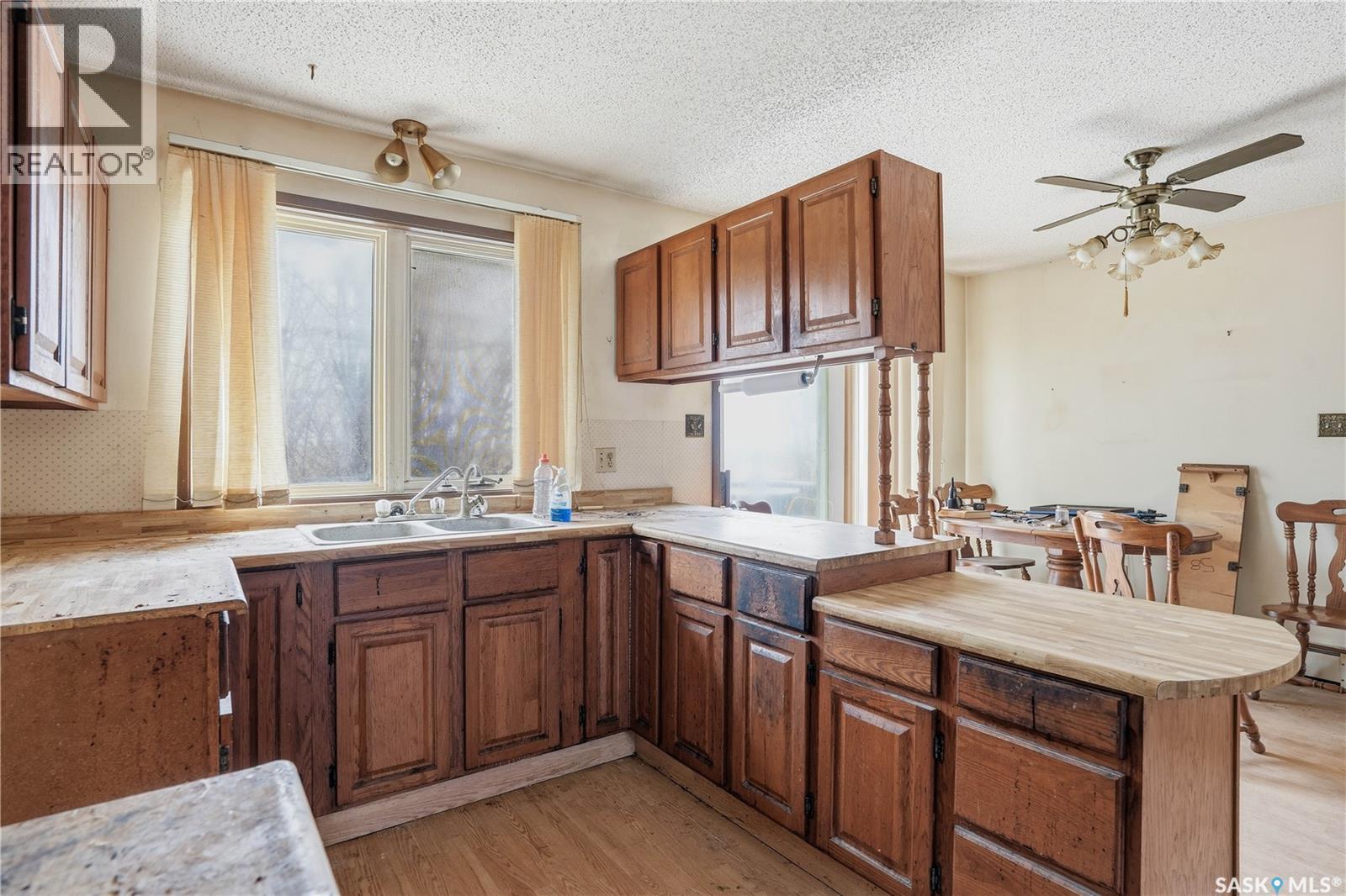 98 Main Street, Lang, SK - Indoor Photo Showing Kitchen With Double Sink