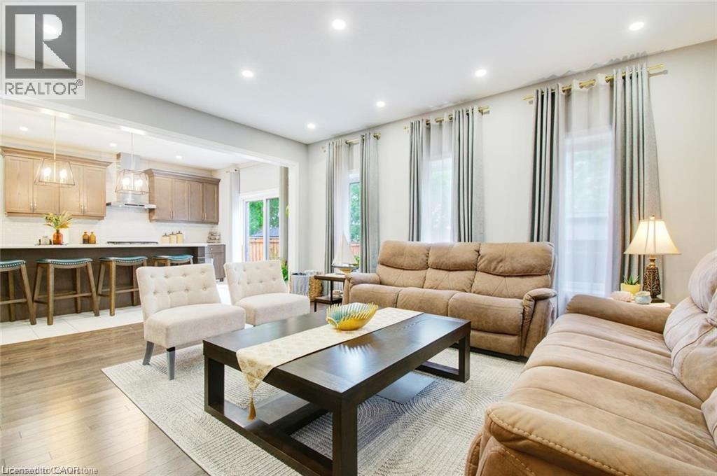 Family room with wood-style flooring and recessed lighting - 49 Scots Pine Trail, Kitchener, ON - Indoor Photo Showing Living Room