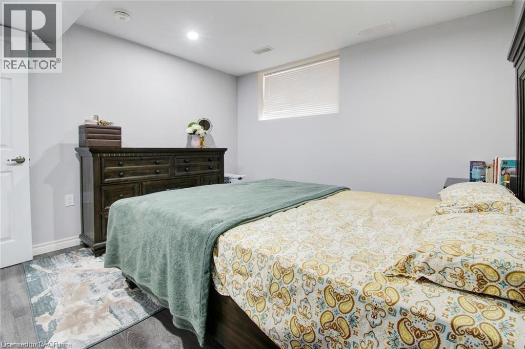 Bedroom with wood finished floors and baseboards - 49 Scots Pine Trail, Kitchener, ON - Indoor Photo Showing Bedroom