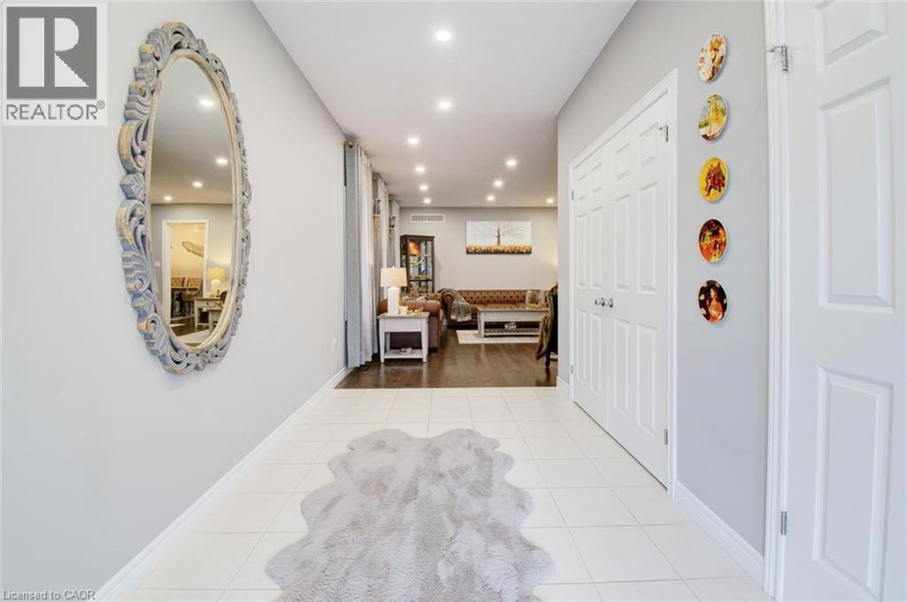 Corridor with light tile patterned floors and recessed lighting - 49 Scots Pine Trail, Kitchener, ON - Indoor Photo Showing Other Room