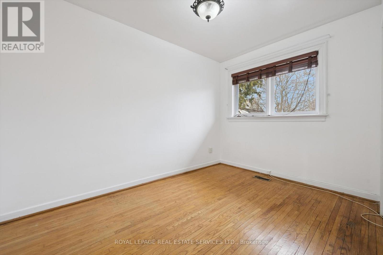 Second Bedroom with Hardwood Flooring - 4169 Wilcox Road, Mississauga, ON - Indoor Photo Showing Other Room