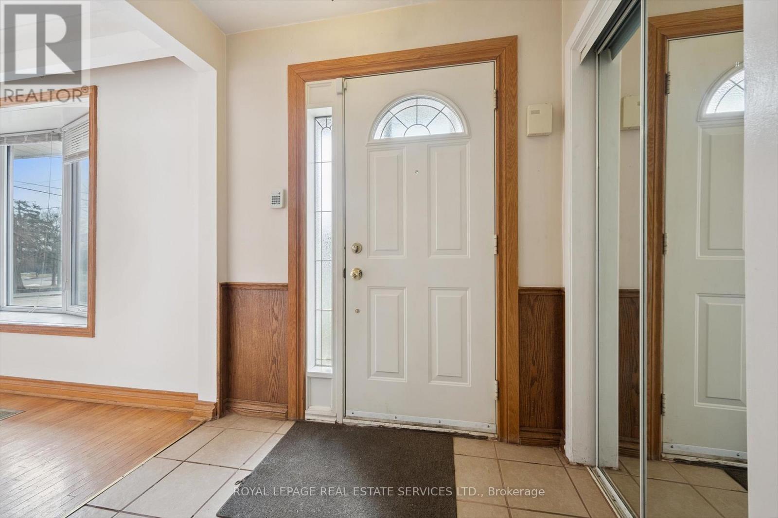 Hardwood Flooring Throughout the Main Level - 4169 Wilcox Road, Mississauga, ON - Indoor Photo Showing Other Room