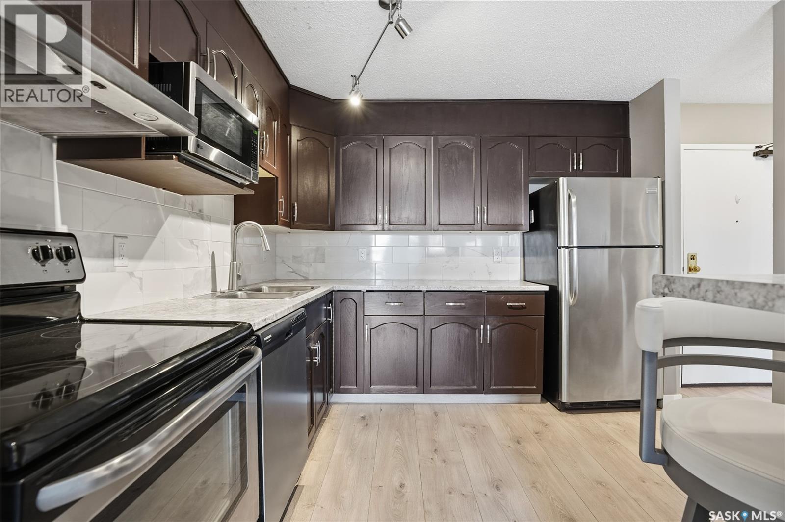 307 2275 Mcintyre Street, Regina, SK - Indoor Photo Showing Kitchen With Double Sink