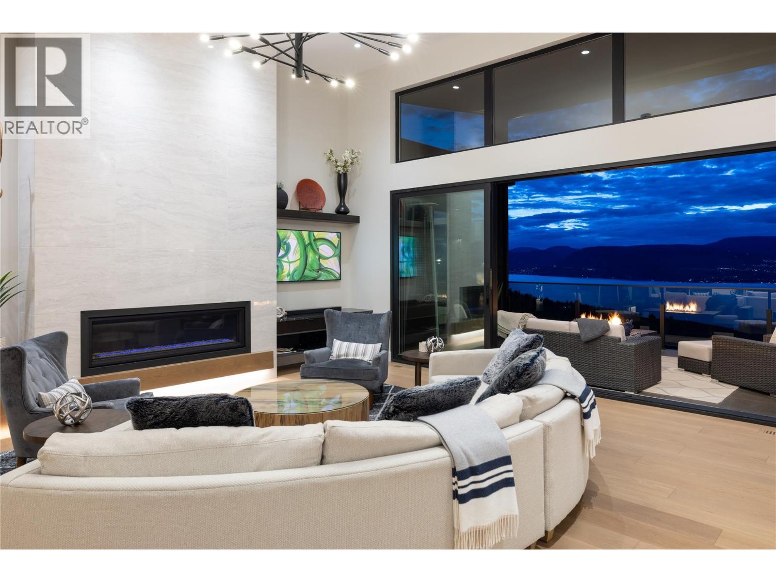 5650 The Edge Place Unit# 111, Kelowna, BC - Indoor Photo Showing Living Room With Fireplace