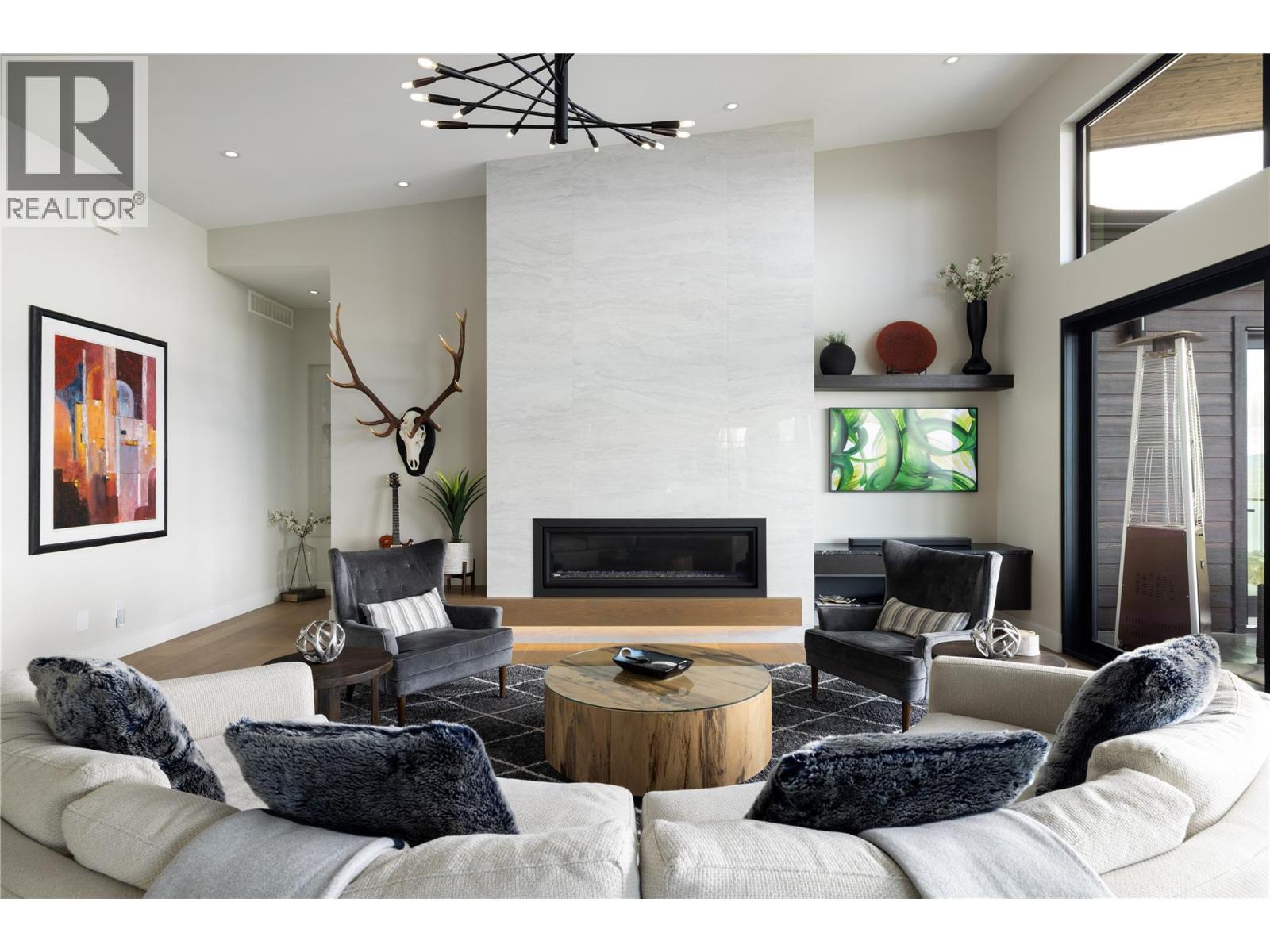 5650 The Edge Place Unit# 111, Kelowna, BC - Indoor Photo Showing Living Room With Fireplace