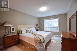 Primary Bedroom with Views of Forested Area -