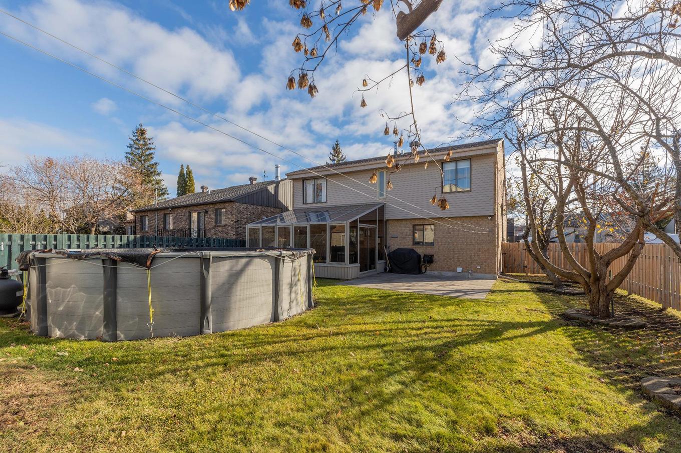 Cour - 275 Rue De Thèbes, Laval (Vimont), QC - Outdoor With Above Ground Pool