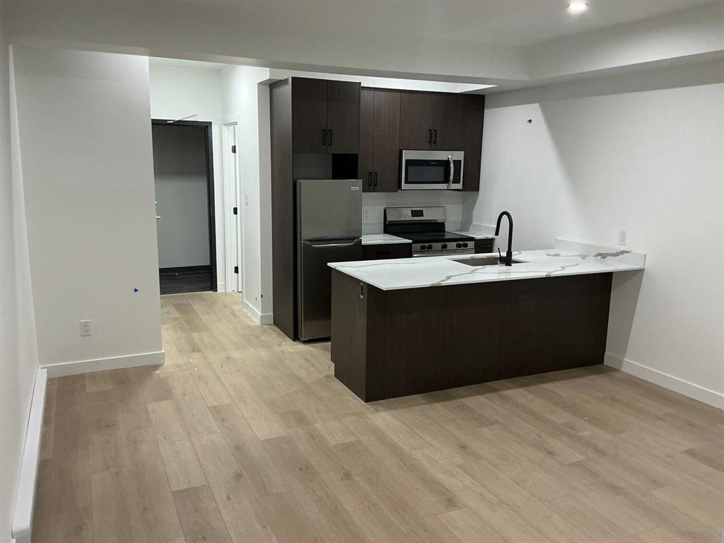 129 5Th Avenue, Swan River, MB - Indoor Photo Showing Kitchen With Double Sink