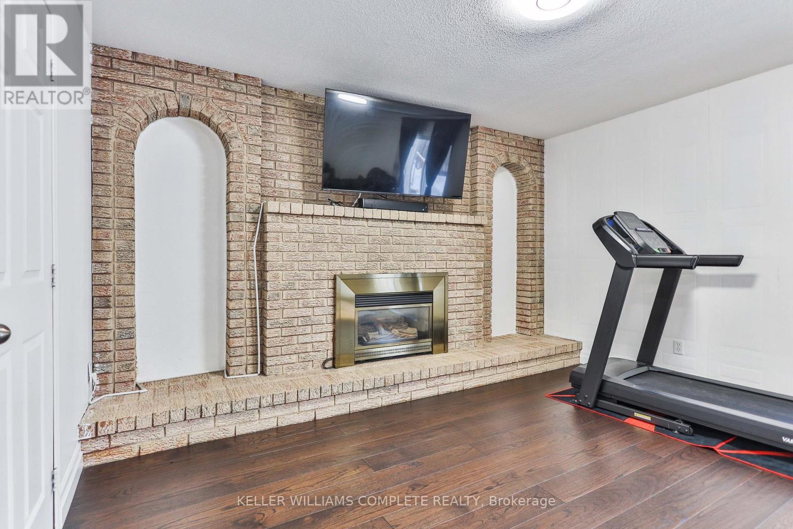 1267 Limeridge Road E, Hamilton, ON - Indoor Photo Showing Gym Room With Fireplace