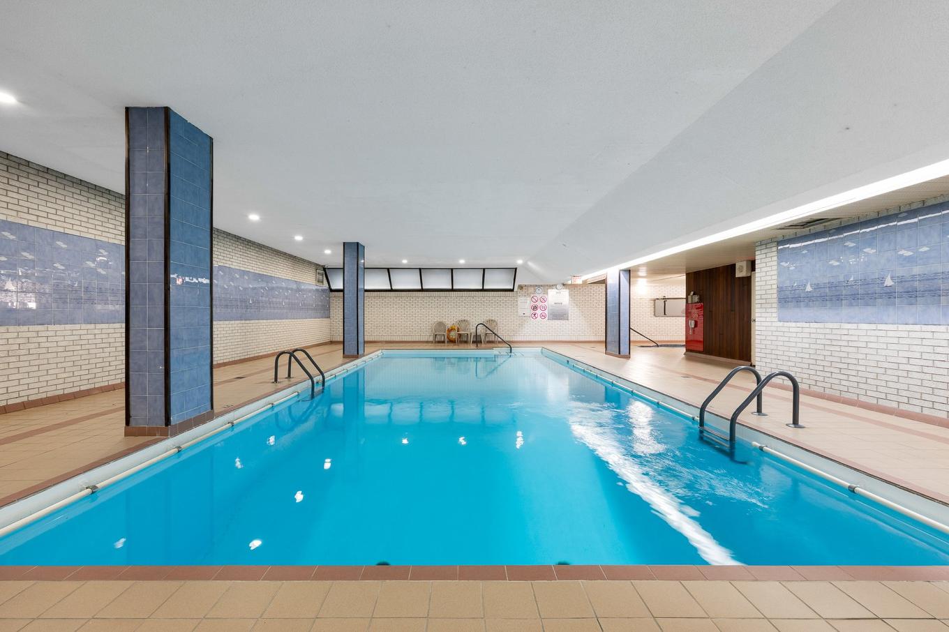 Pool - 107-5740 Av. Rembrandt, Côte-Saint-Luc, QC - Indoor Photo Showing Other Room With In Ground Pool