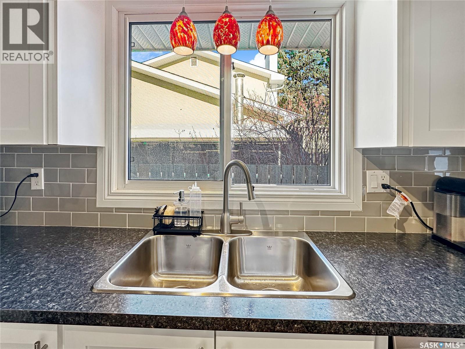 19 Marquis Crescent, Regina, SK - Indoor Photo Showing Kitchen With Double Sink