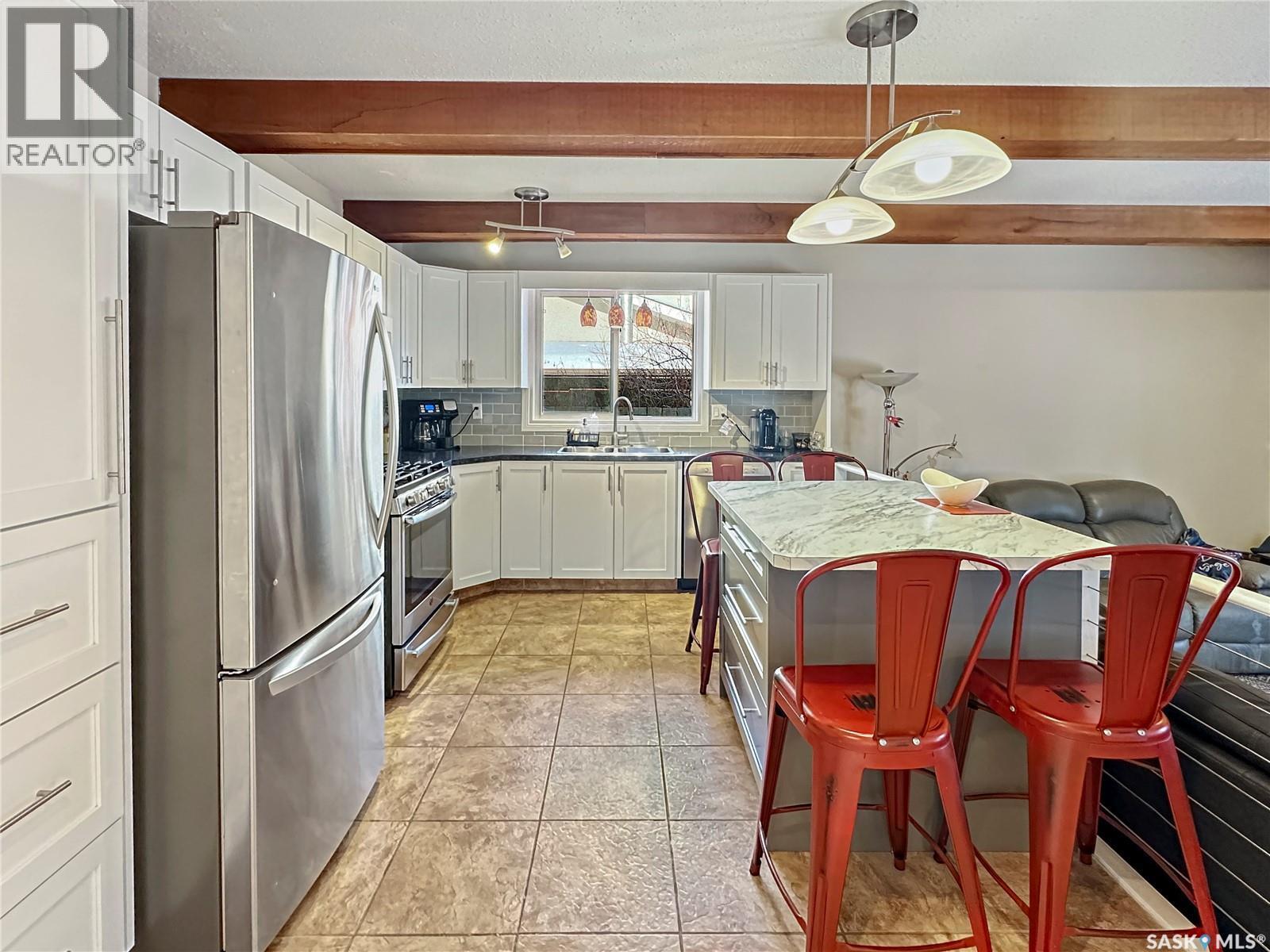 19 Marquis Crescent, Regina, SK - Indoor Photo Showing Kitchen With Double Sink