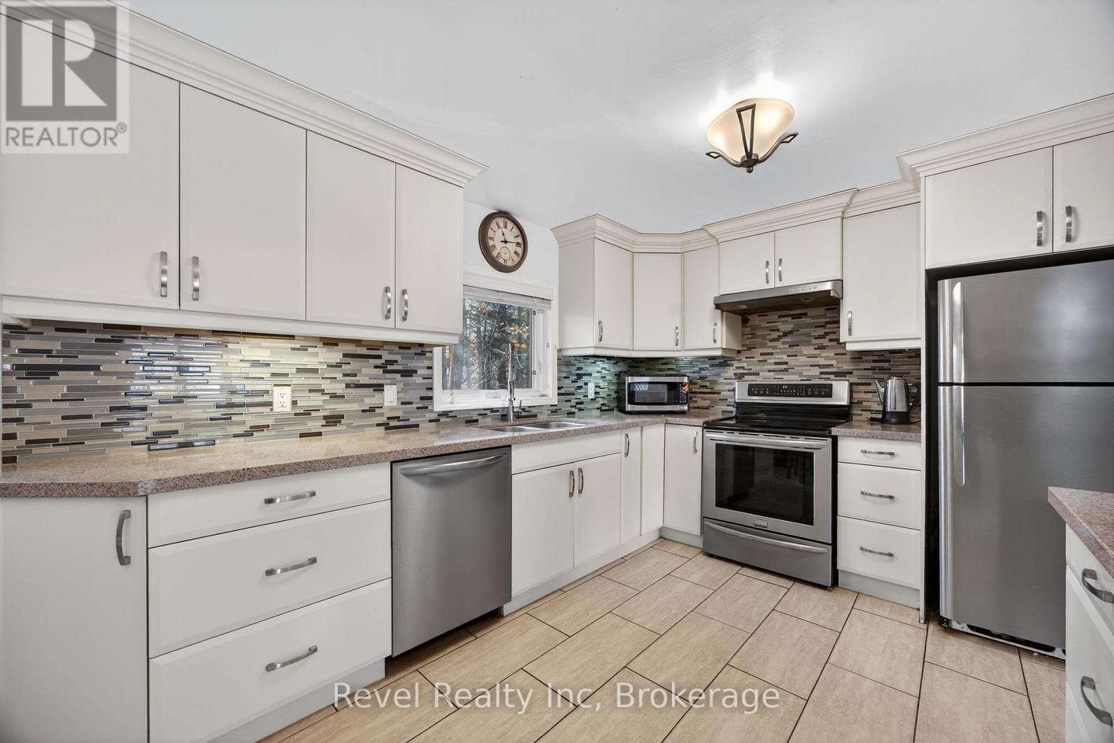 144 Trout Lane, Tiny, ON - Indoor Photo Showing Kitchen With Double Sink