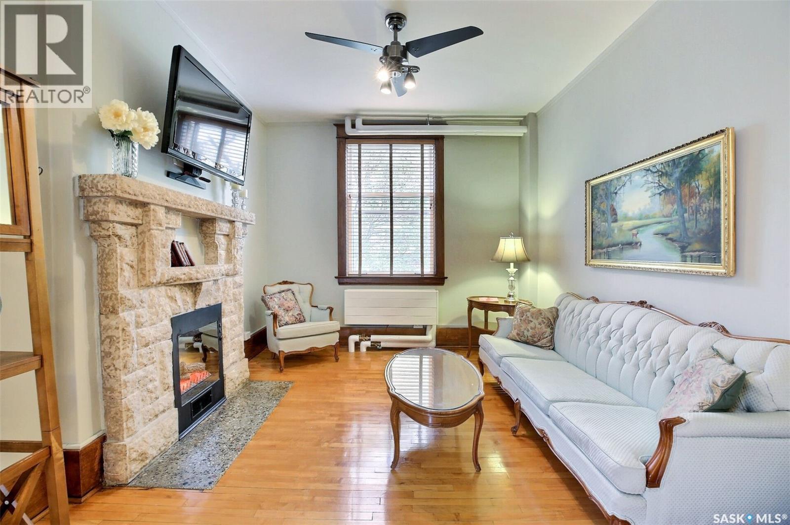 8 2201 14Th Avenue, Regina, SK - Indoor Photo Showing Living Room With Fireplace